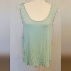 White crow, size xl, light teal with an open twisted back. Like new.